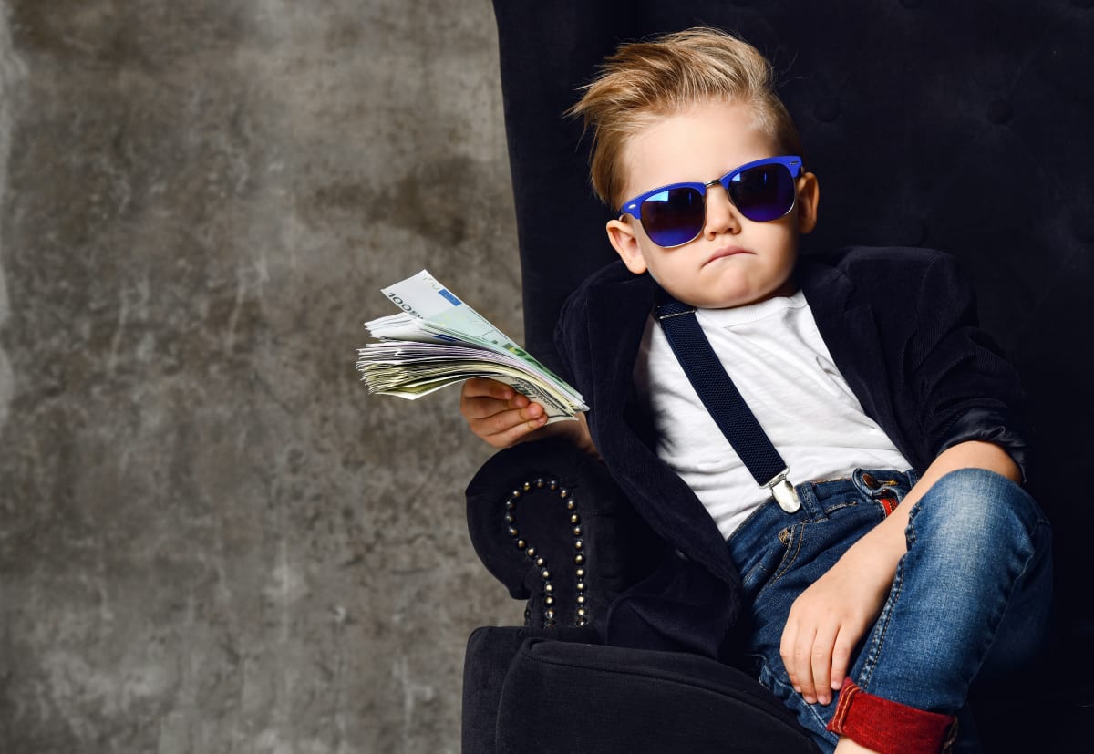 toddler holding money